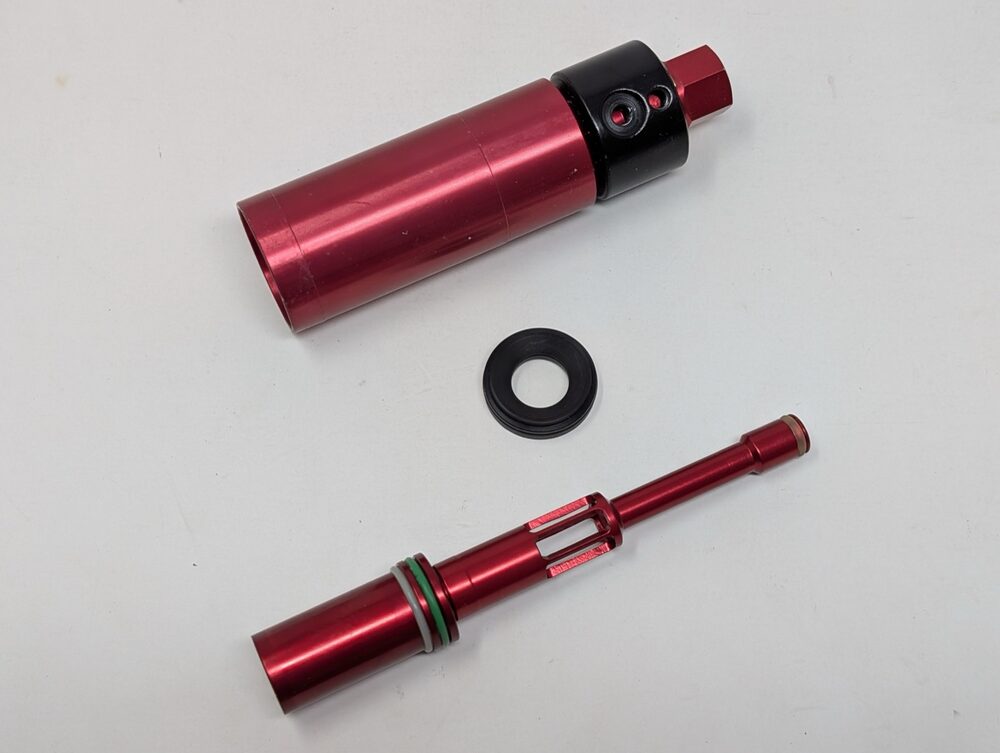 Fire chamber, bolt stop, and bolt with insert removed, laid out rear to front