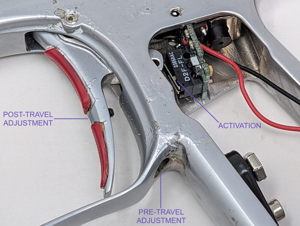 All three trigger adjustment points labeled — pre-travel, post-travel, activation