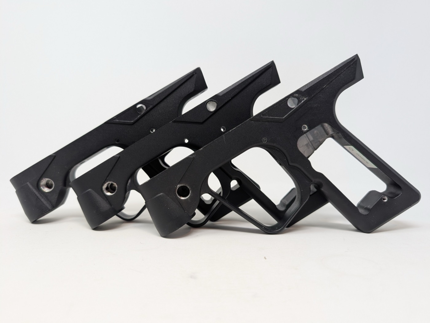 Ion 1.0, Ion 2.0, and Ion XE grip frames, left to right