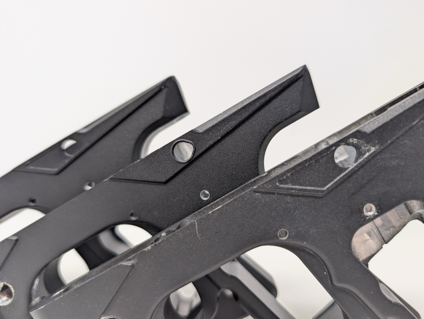 Top rail and rear hump, close up — same profile on all three