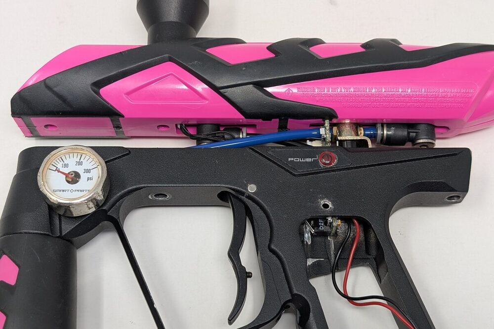 Body separated from grip frame, banjo fittings visible