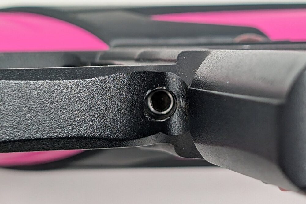 Magnet screw location — base of the trigger guard